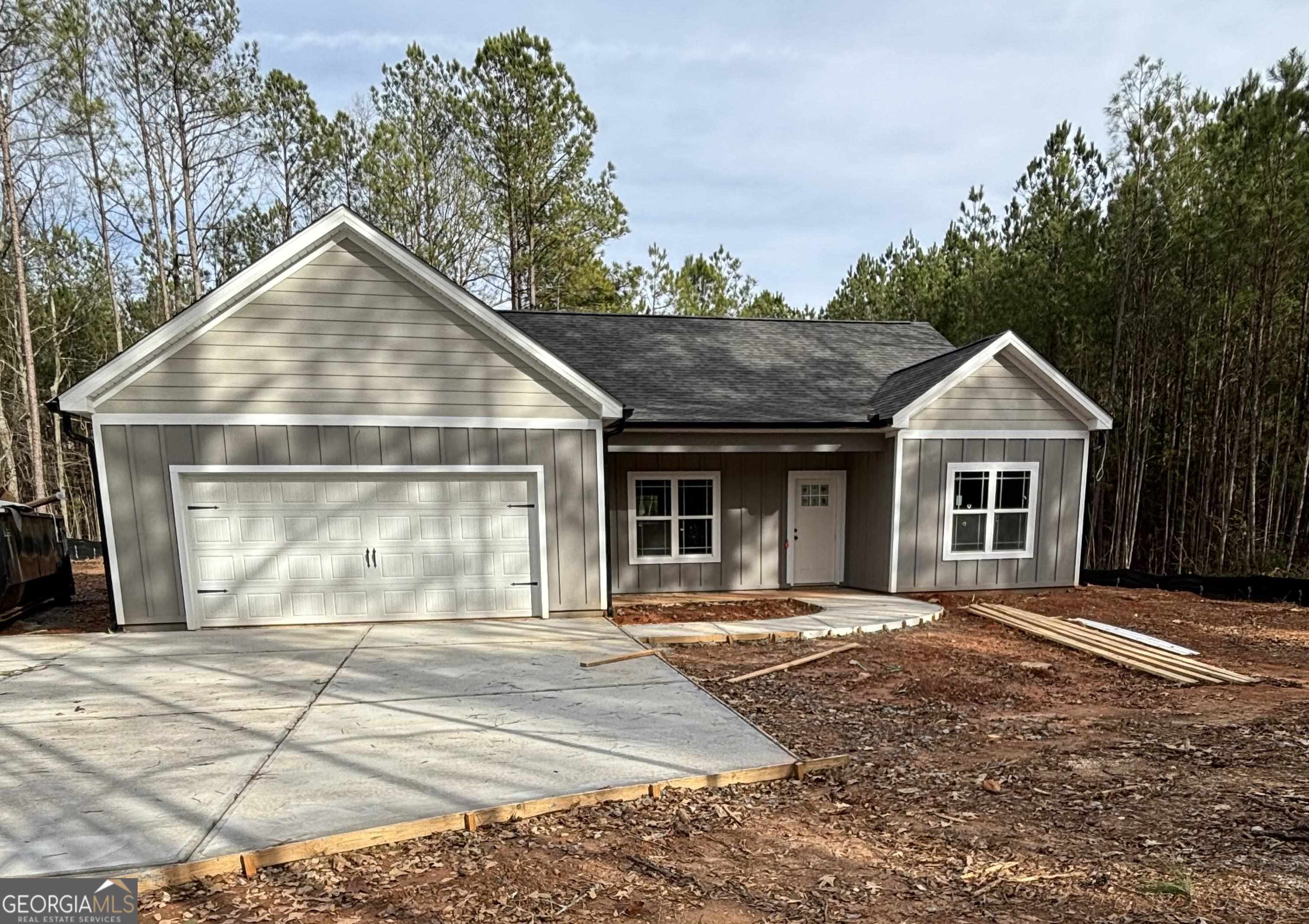 401 Fenner Road Jackson, GA 30233 - Photo 1 of 1 a view of a house with a yard next to a house
