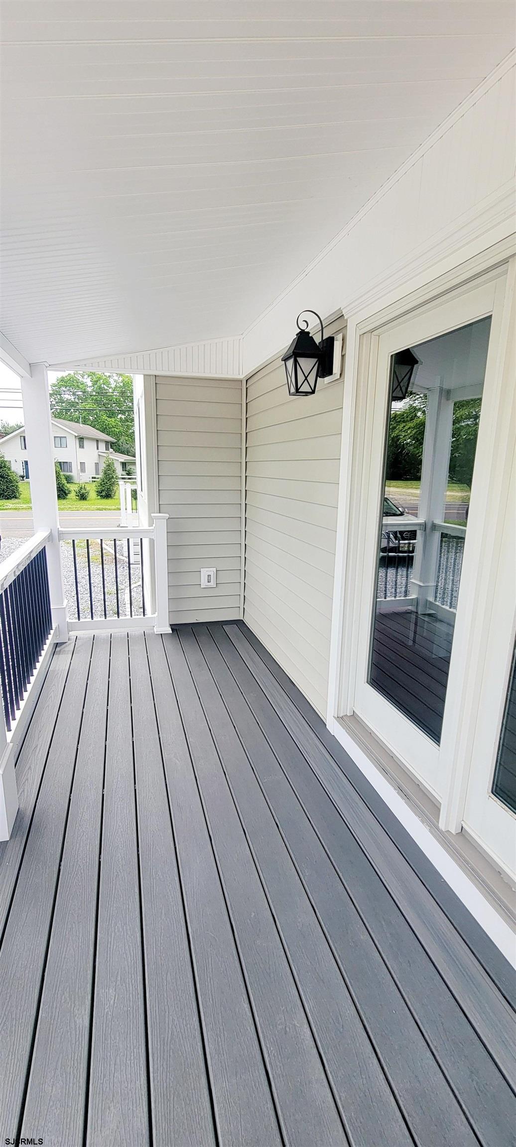 6594 Mill Road Egg Harbor Township, NJ 08234 - Photo 11 of 72 a view of balcony with wooden floor