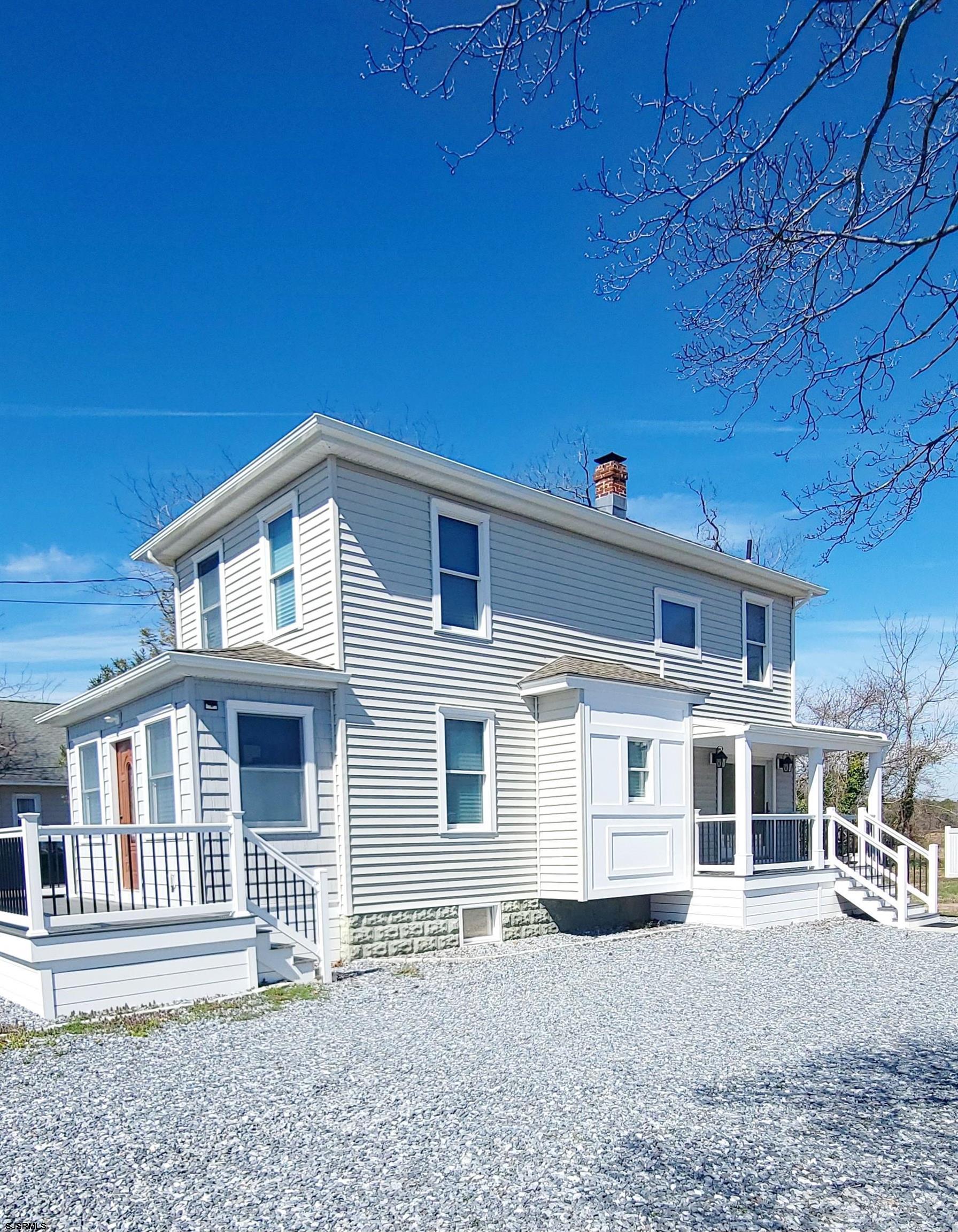 6594 Mill Road Egg Harbor Township, NJ 08234 - Photo 2 of 72 a front view of a house with a yard