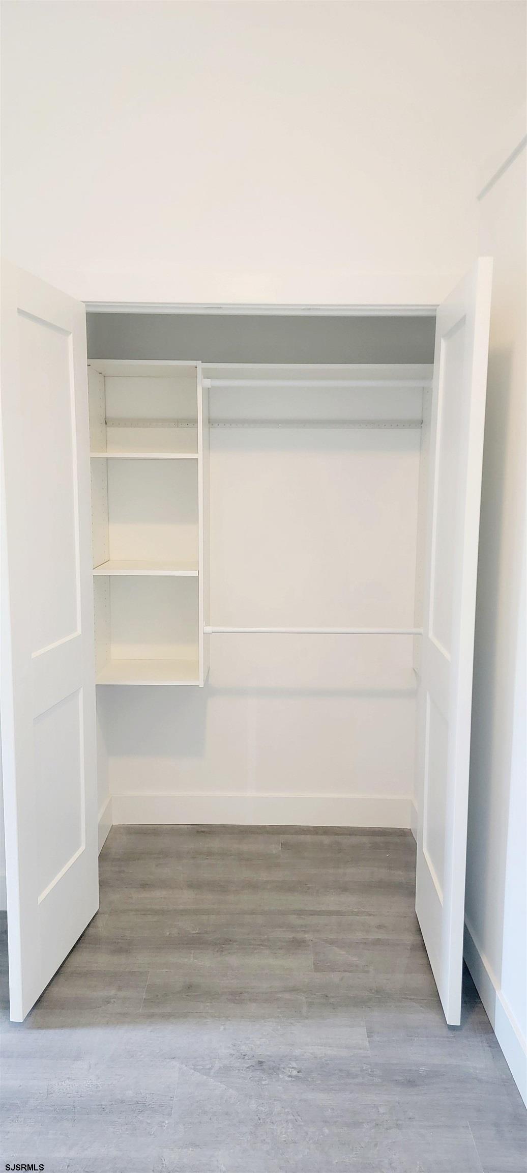 6594 Mill Road Egg Harbor Township, NJ 08234 - Photo 25 of 72 a view of walk in closet with empty racks