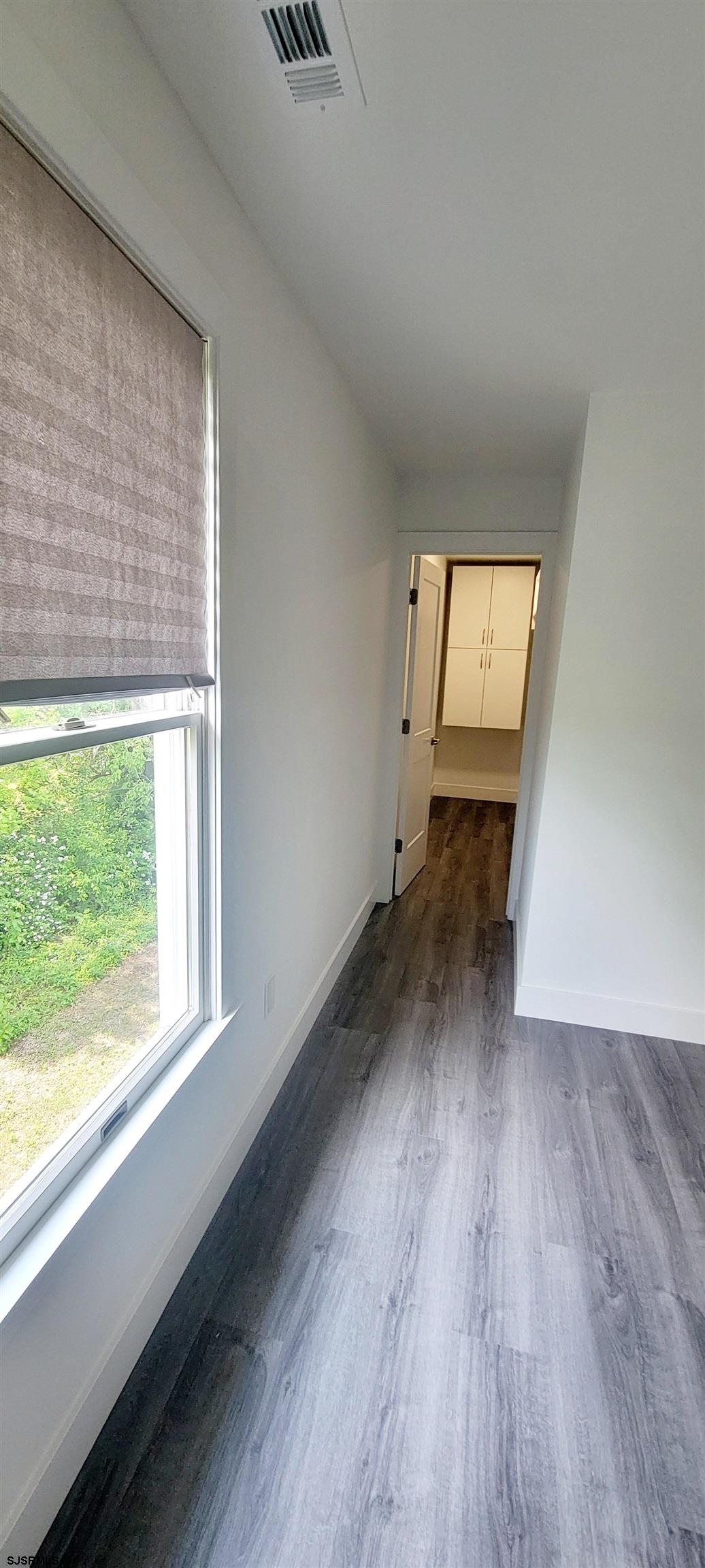 6594 Mill Road Egg Harbor Township, NJ 08234 - Photo 34 of 72 a view of a room that has wooden floor and a window