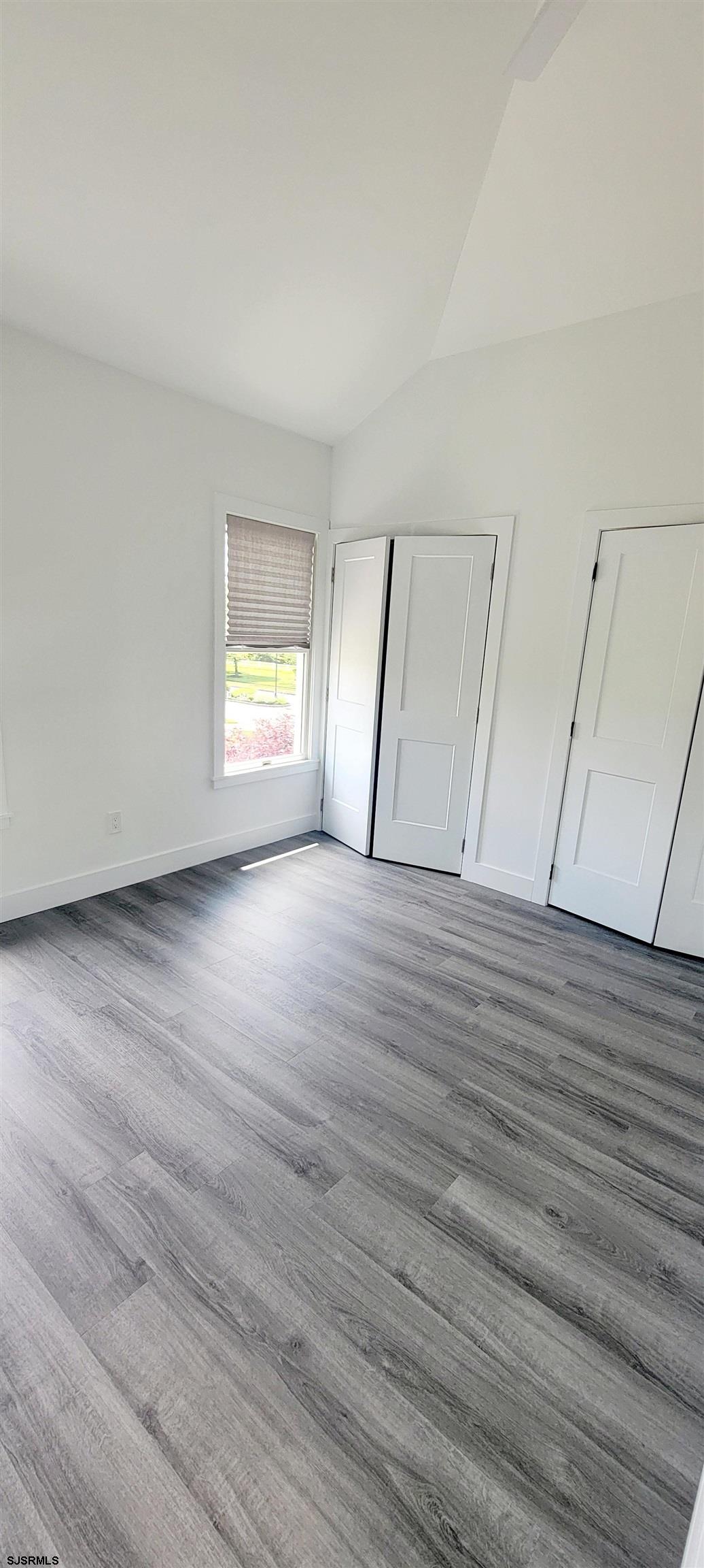 6594 Mill Road Egg Harbor Township, NJ 08234 - Photo 37 of 72 a view of an empty room with wooden floor and window