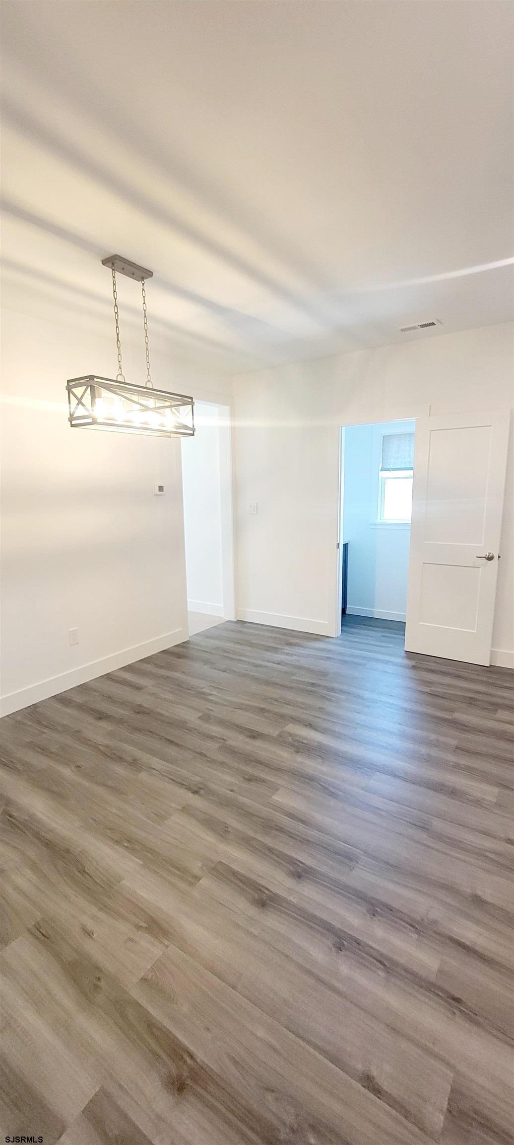 6594 Mill Road Egg Harbor Township, NJ 08234 - Photo 44 of 72 wooden floor in an empty room