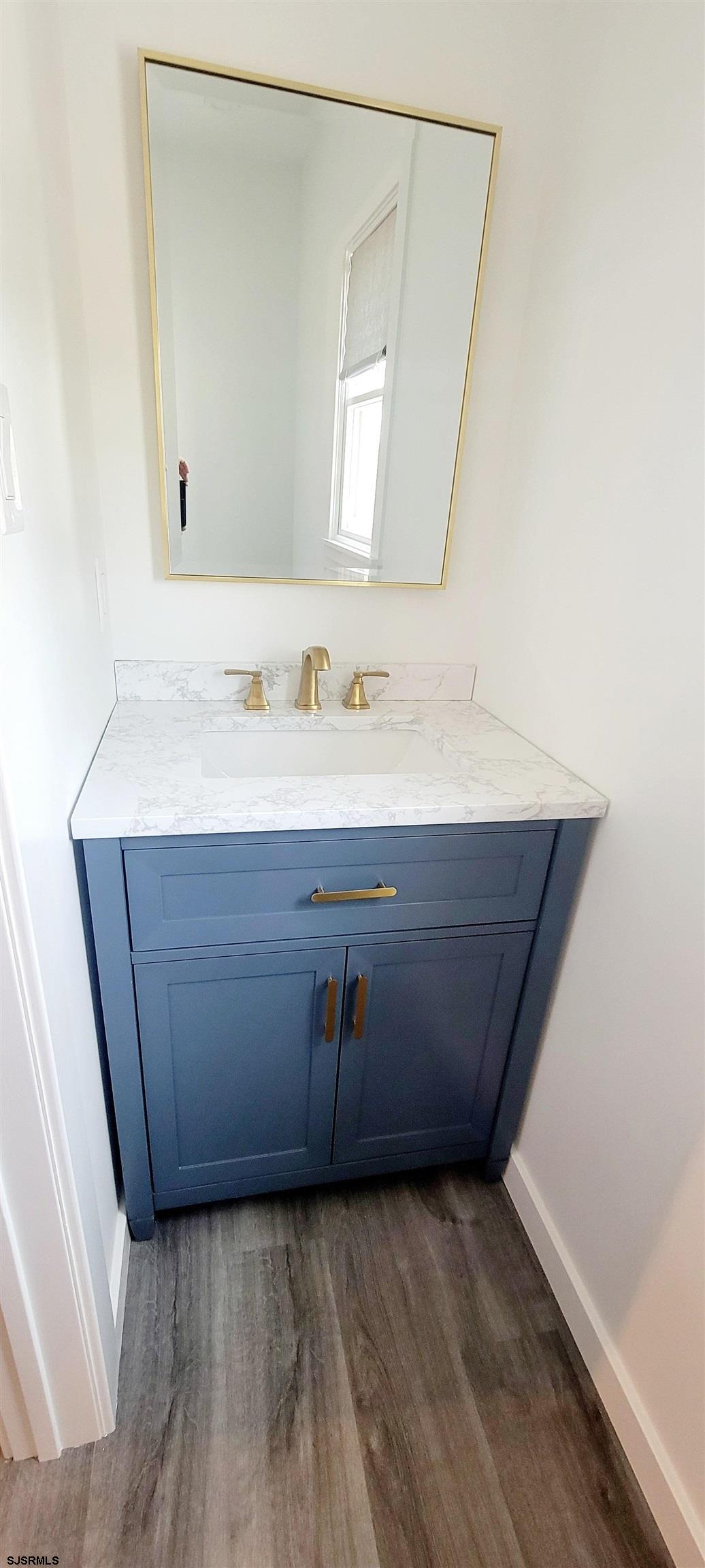 6594 Mill Road Egg Harbor Township, NJ 08234 - Photo 47 of 72 a room with a sink and a mirror