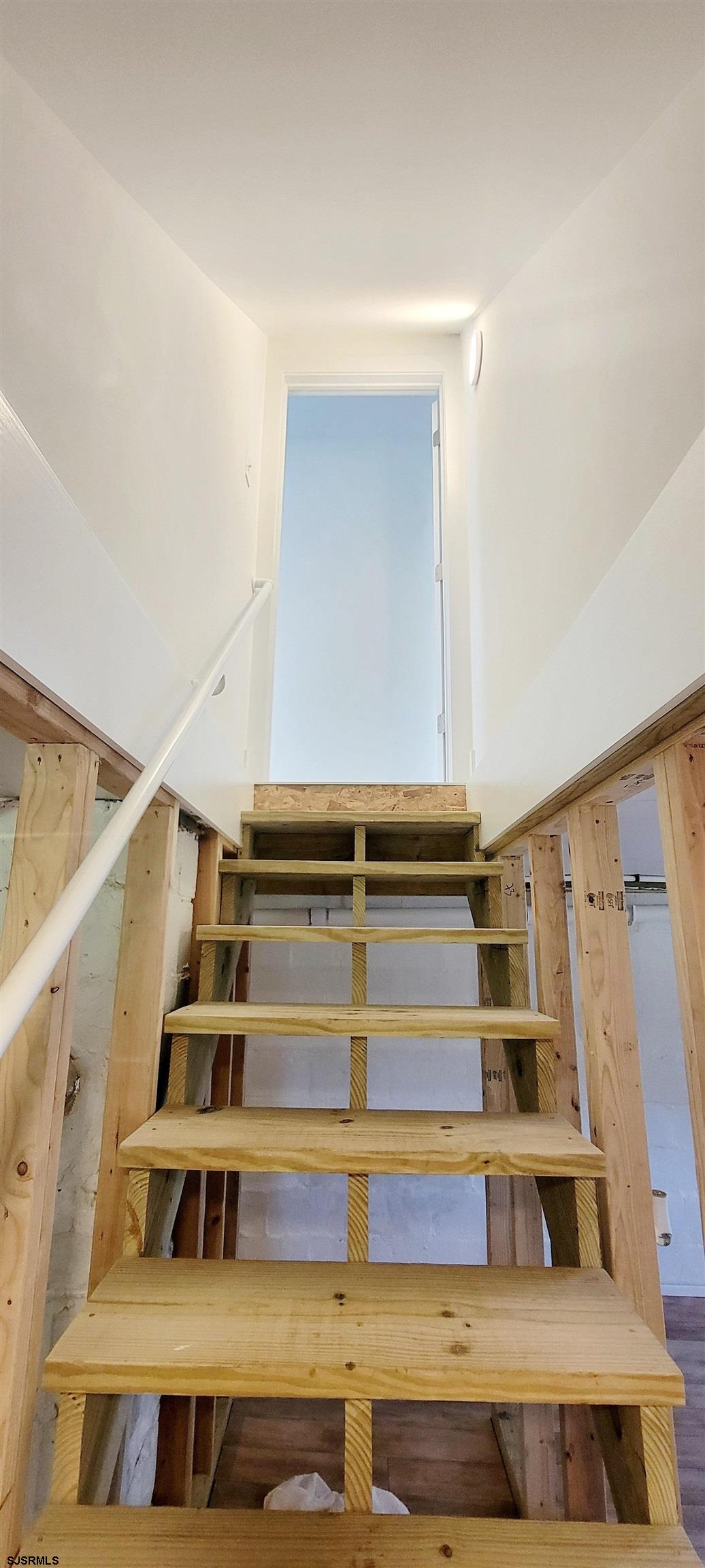 6594 Mill Road Egg Harbor Township, NJ 08234 - Photo 53 of 72 a view of staircase with white walls and a window