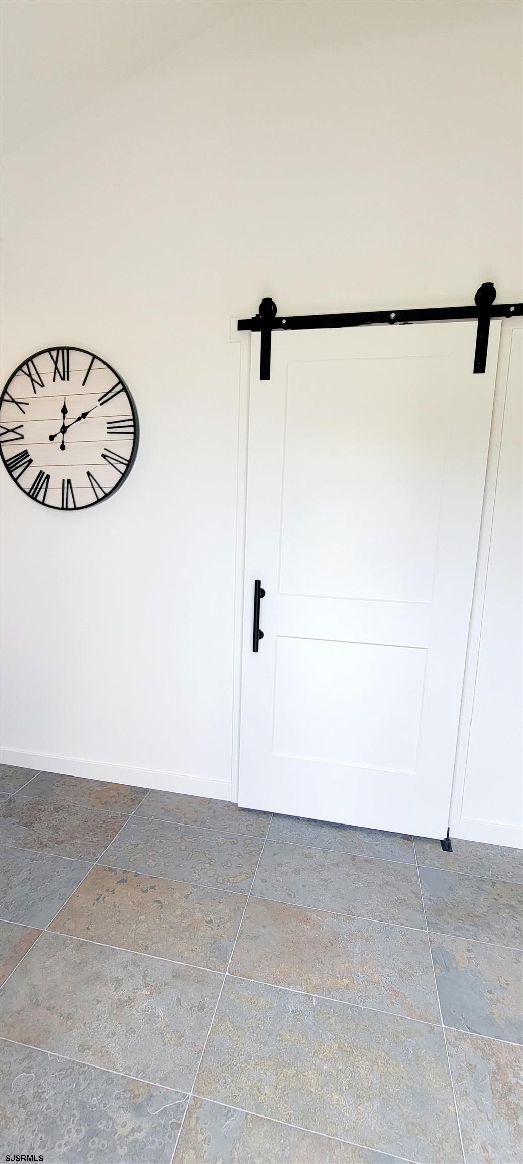 6594 Mill Road Egg Harbor Township, NJ 08234 - Photo 66 of 72 a view of a room with rack on the wall