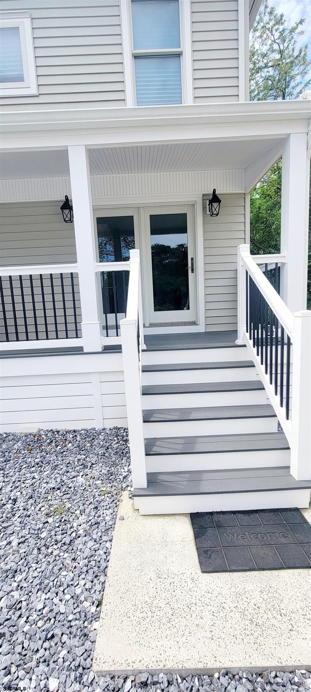 6594 Mill Road Egg Harbor Township, NJ 08234 - Photo 8 of 72 a view of a house with a deck