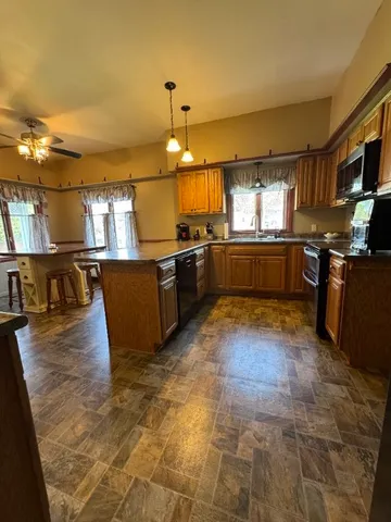 a large kitchen with lots of counter space and appliances