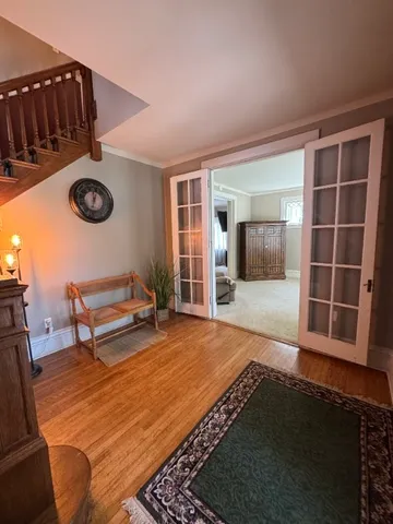 a bedroom with furniture and a window