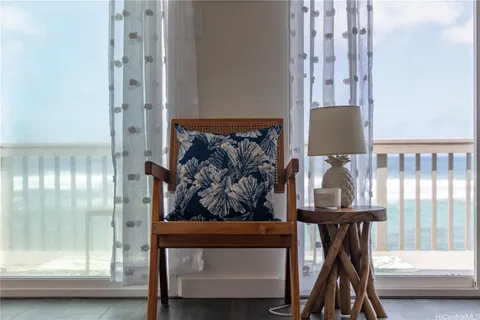 a view of hall way with furniture and windows