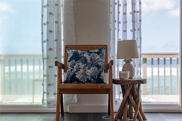 a view of hall way with furniture and windows