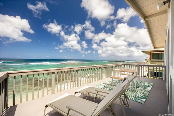 a view of a balcony with wooden floor