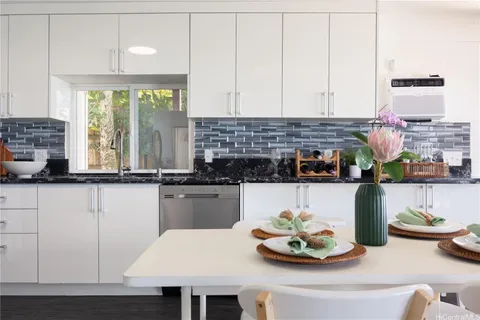 a kitchen with a table and chairs