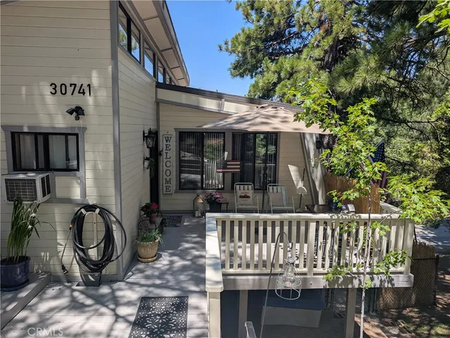 a view of a chair and table in the patio