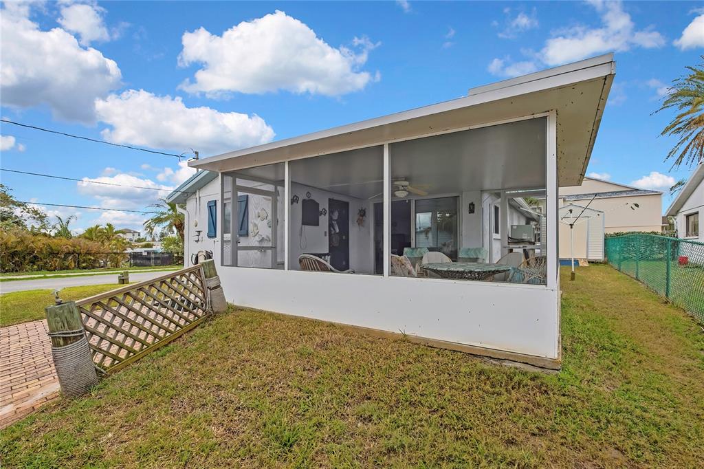 6601 Sea Ranch Drive Hudson, FL 34667 - Photo 19 of 43 a view of a house with backyard and porch