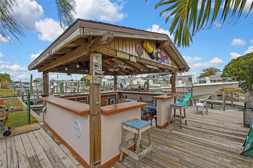 6601 Sea Ranch Drive Hudson, FL 34667 - Photo 21 of 43 a view of a balcony with chairs and wooden floor