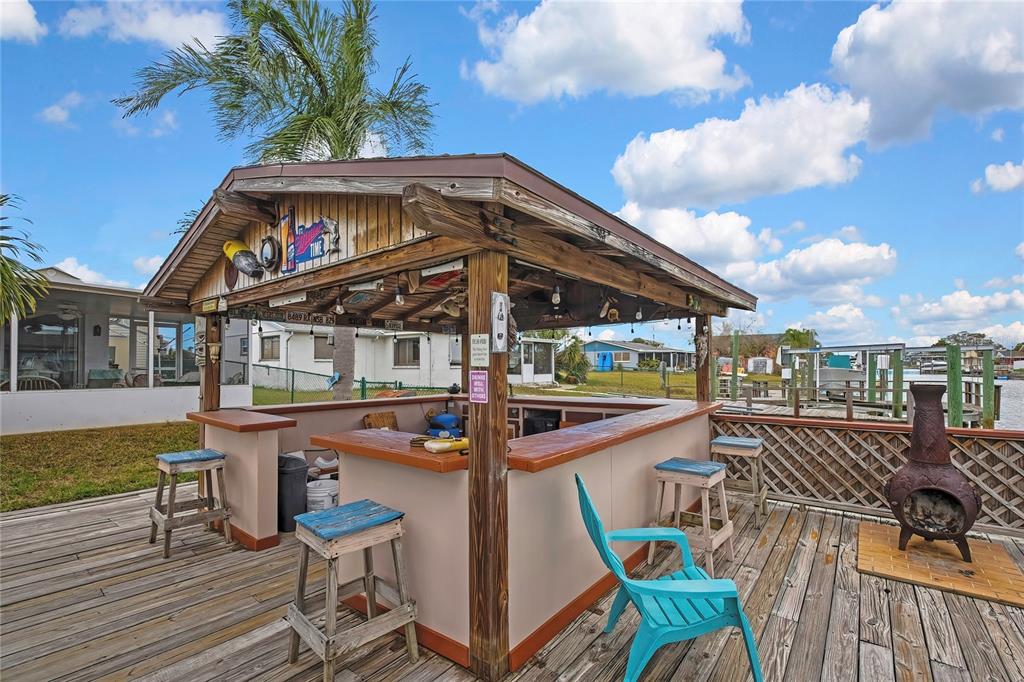 6601 Sea Ranch Drive Hudson, FL 34667 - Photo 24 of 43 a view of a chairs and table in the patio