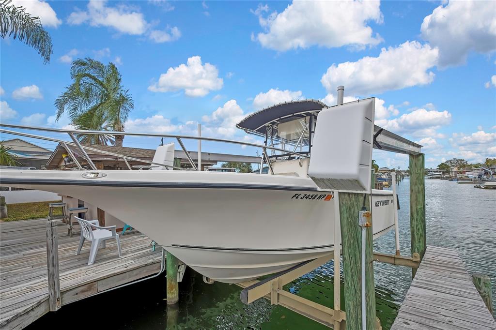 6601 Sea Ranch Drive Hudson, FL 34667 - Photo 27 of 43 a roof deck with table and chairs