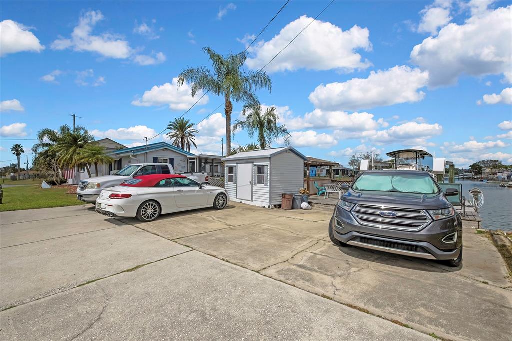 6601 Sea Ranch Drive Hudson, FL 34667 - Photo 30 of 43 a view of a car park in front of house