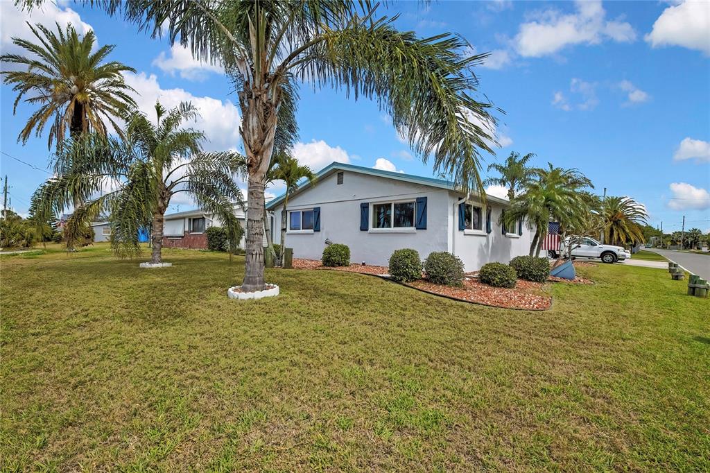 6601 Sea Ranch Drive Hudson, FL 34667 - Photo 32 of 43 a view of a house with a yard
