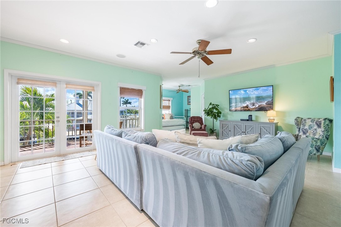2761 Geary Street Matlacha, FL 33993 - Photo 14 of 50 a living room with furniture and a window