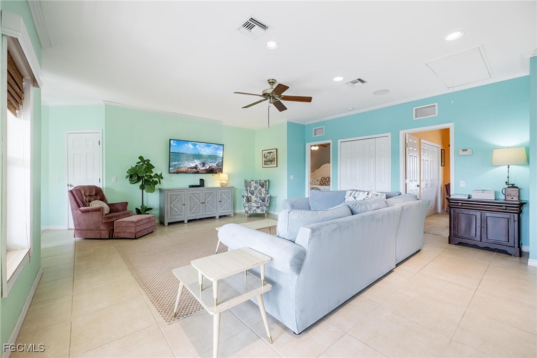 2761 Geary Street Matlacha, FL 33993 - Photo 17 of 50 a living room with furniture and a flat screen tv