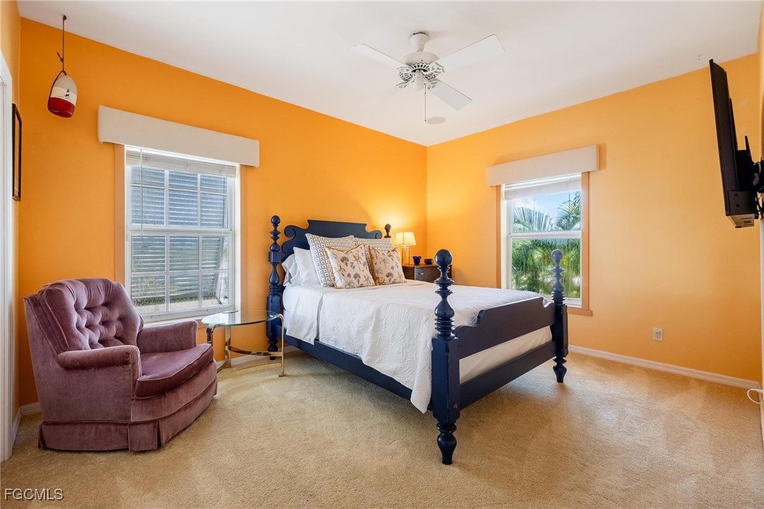 2761 Geary Street Matlacha, FL 33993 - Photo 21 of 50 a bedroom with a bed couch and window