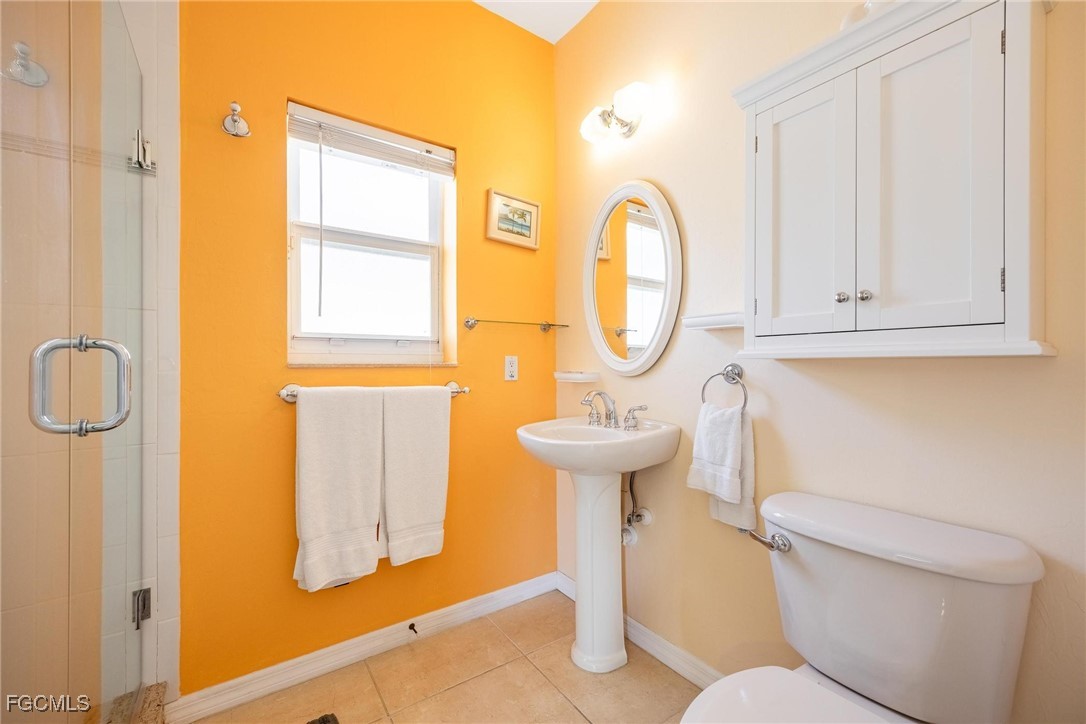 2761 Geary Street Matlacha, FL 33993 - Photo 23 of 50 a bathroom with a sink a toilet and a mirror