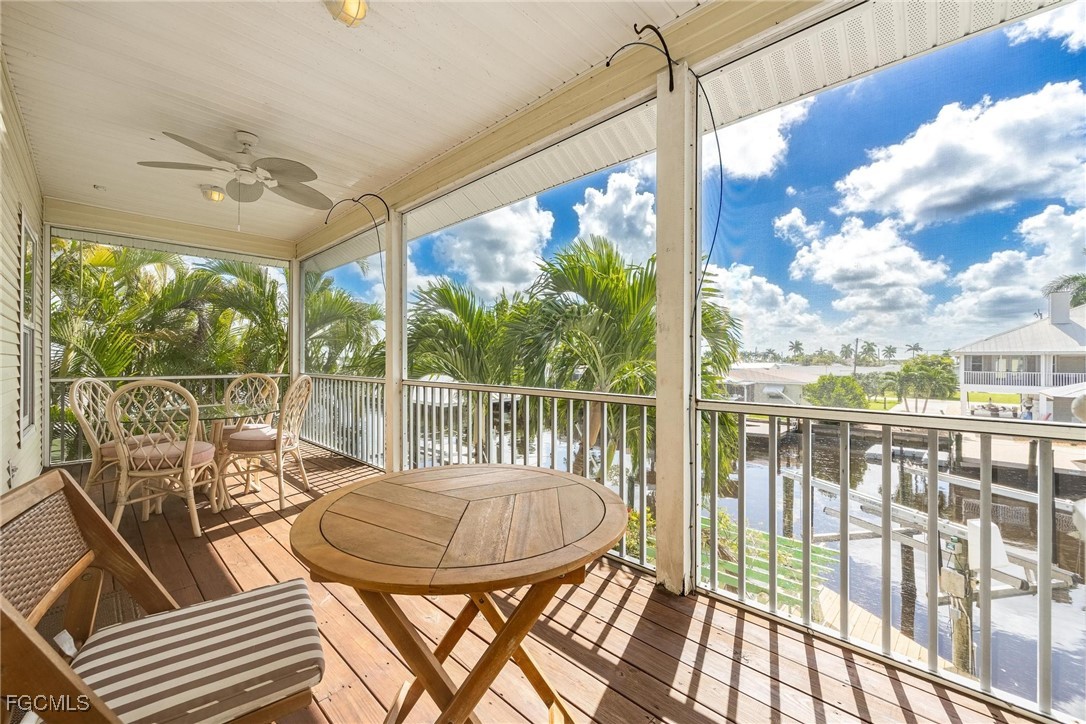 2761 Geary Street Matlacha, FL 33993 - Photo 27 of 50 a view of a balcony with table and chairs