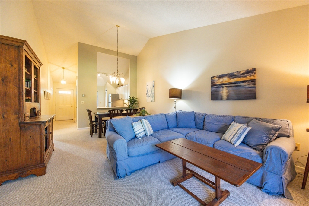 78 Eaton Lane, Unit 78 Brewster, MA 02631 - Photo 12 of 41 a living room with furniture and a lamp
