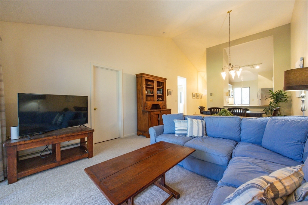 78 Eaton Lane, Unit 78 Brewster, MA 02631 - Photo 14 of 41 a living room with furniture and a flat screen tv