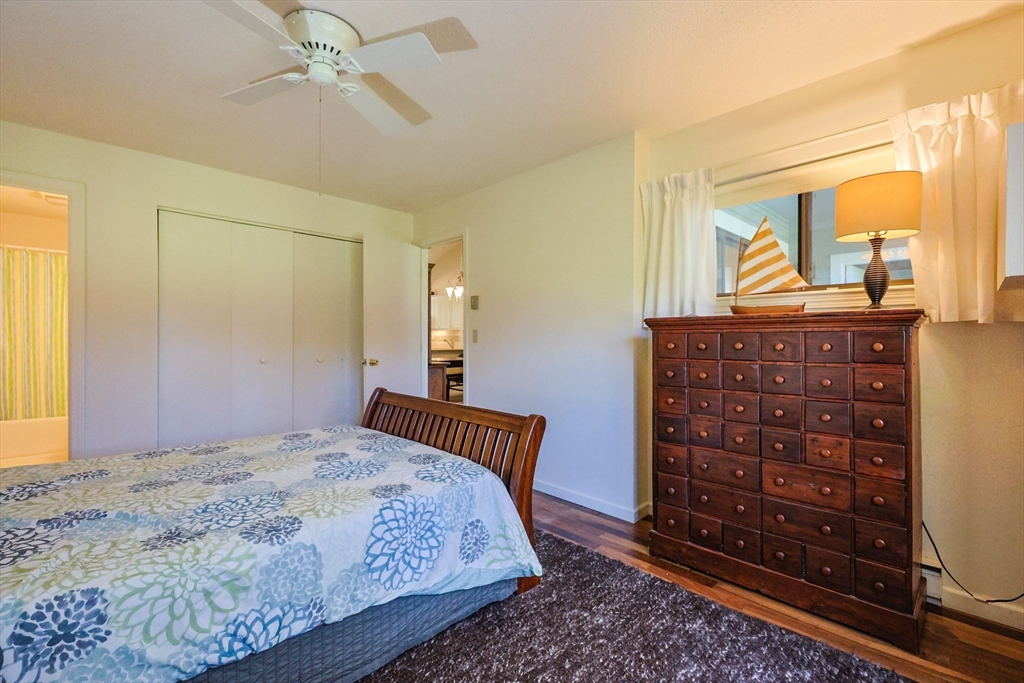 78 Eaton Lane, Unit 78 Brewster, MA 02631 - Photo 21 of 41 a bedroom with a bed and a dresser
