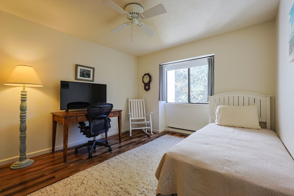 78 Eaton Lane, Unit 78 Brewster, MA 02631 - Photo 22 of 41 a bedroom with a bed and a window