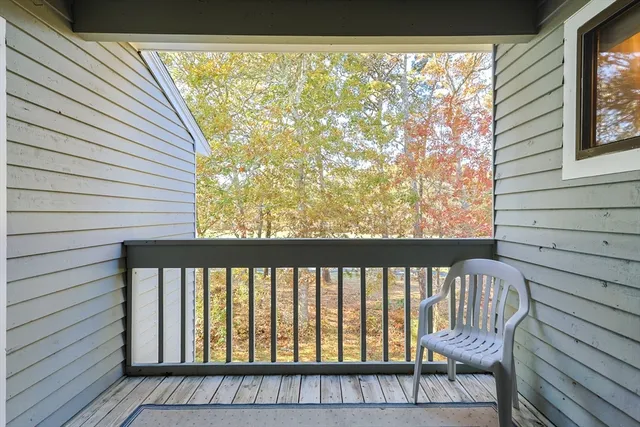 a view of a balcony with wooden floor