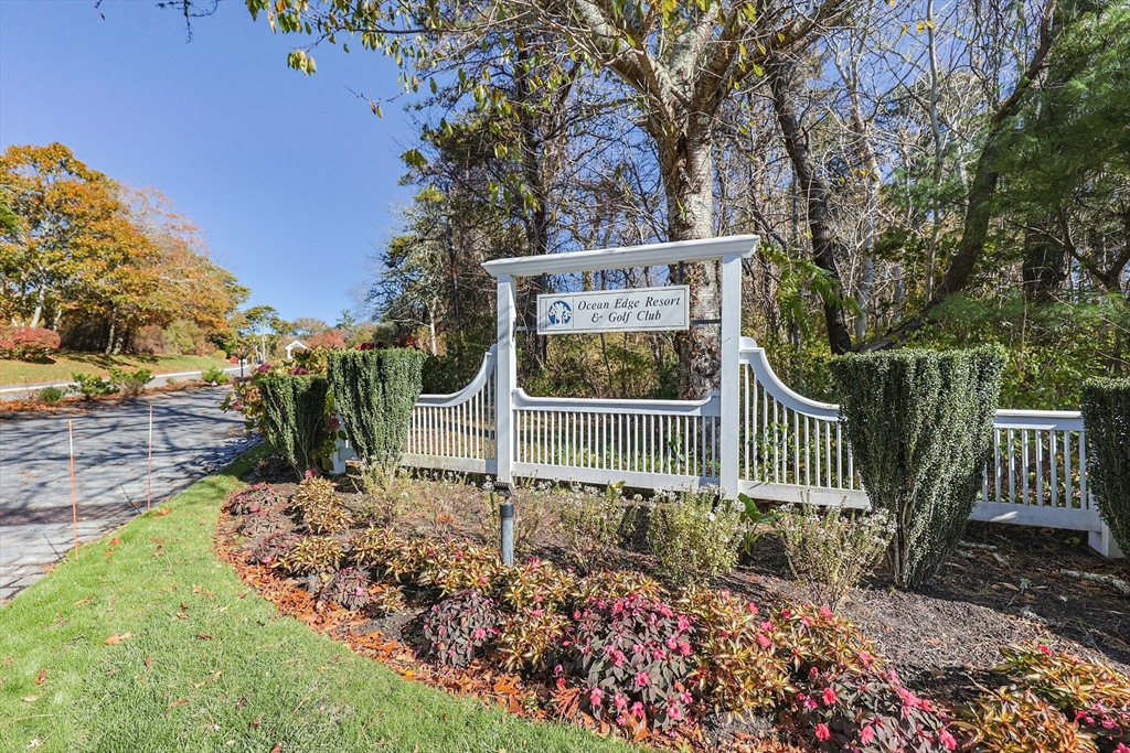 78 Eaton Lane, Unit 78 Brewster, MA 02631 - Photo 40 of 41 a view of a deck with a yard and potted plants