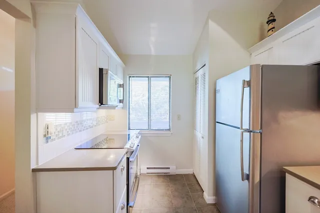 a kitchen with a refrigerator a sink and dishwasher