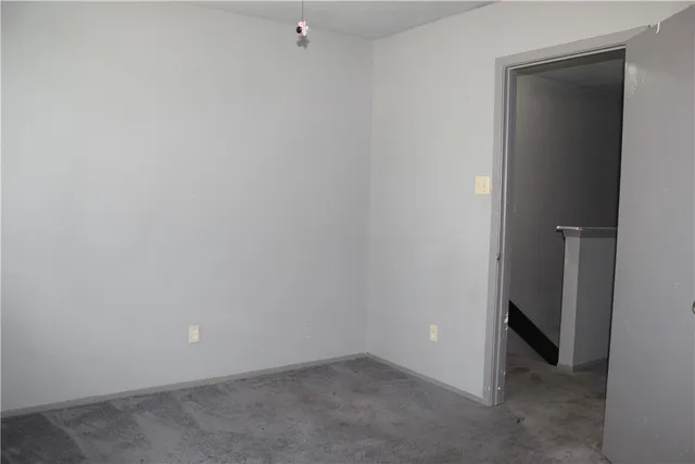 a white toilet sitting next to a bathtub