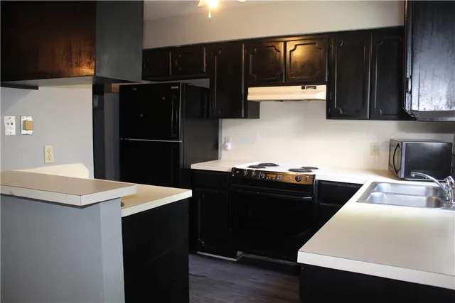 a kitchen with a stove and a microwave
