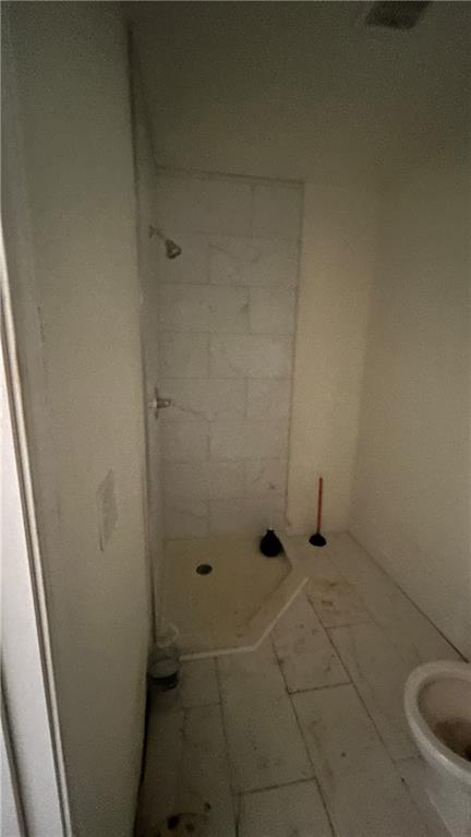 4181 Danforth Road Southwest Atlanta, GA 30331 - Photo 13 of 18 a bathroom with a granite countertop shower and a toilet