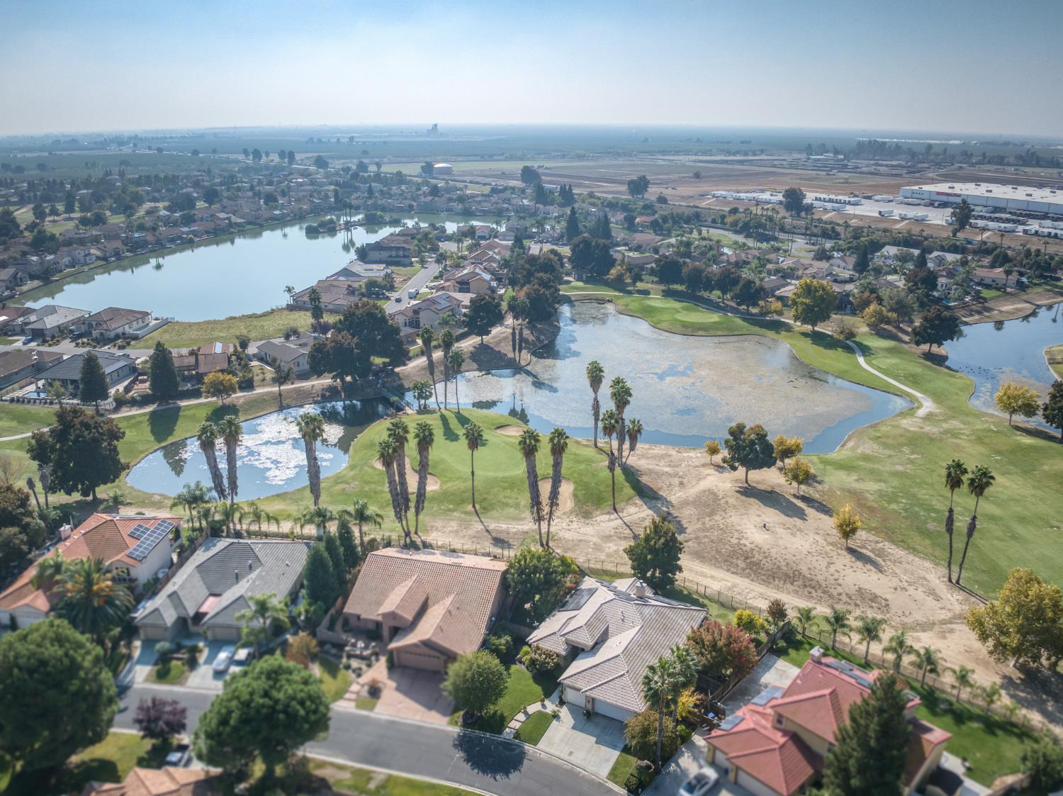 7360 Edgewater Street Chowchilla, CA 93610 - Photo 13 of 44 an aerial view of lake residential house with outdoor space and river