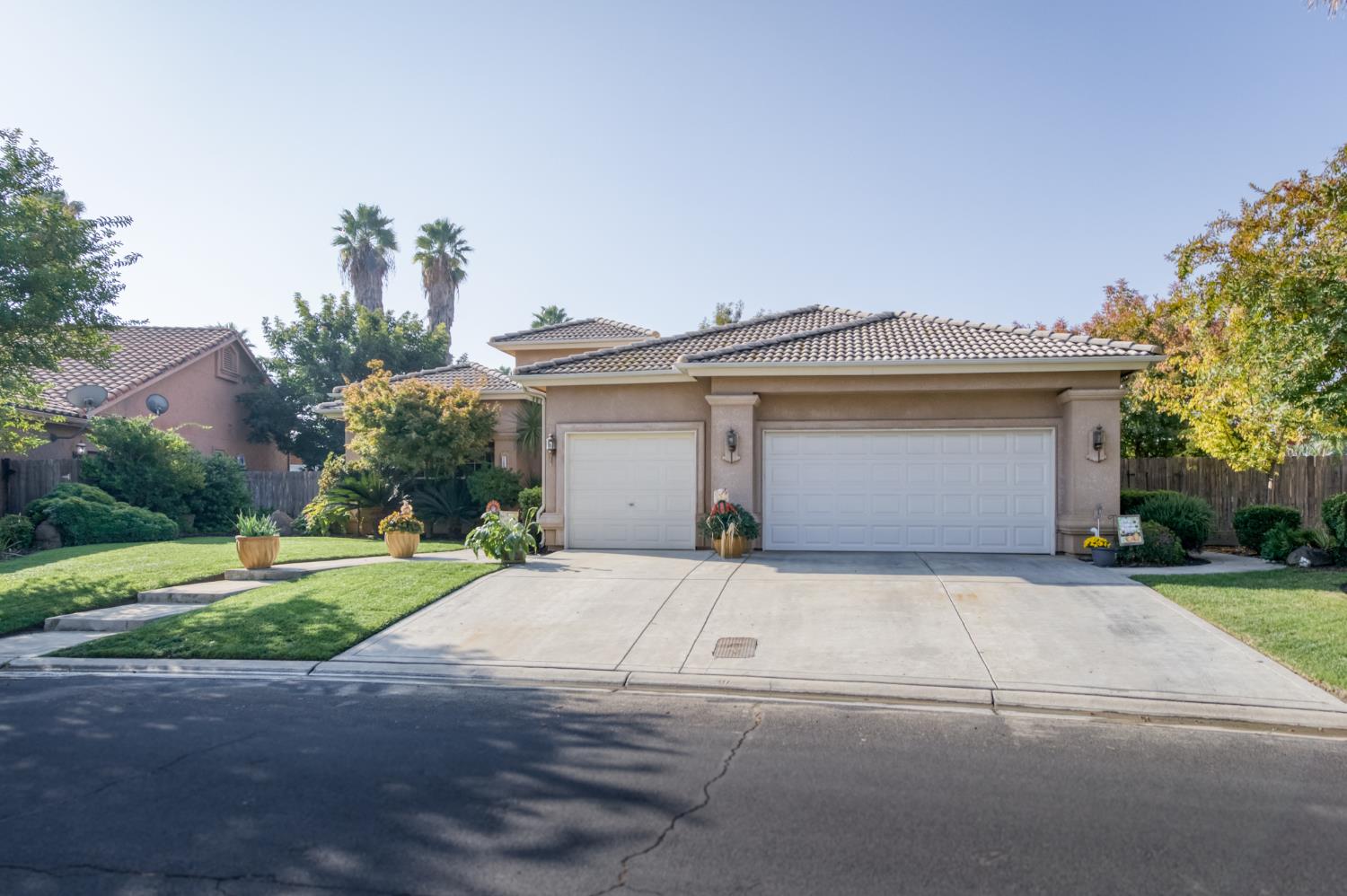 7360 Edgewater Street Chowchilla, CA 93610 - Photo 16 of 44 front view of a house with a yard