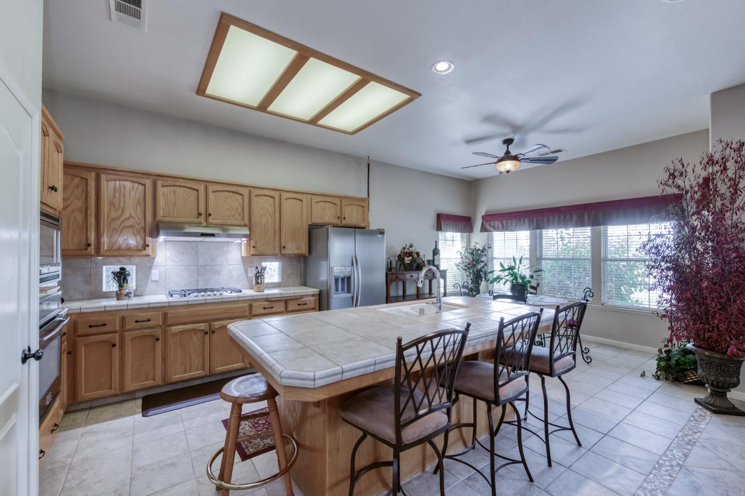 7360 Edgewater Street Chowchilla, CA 93610 - Photo 22 of 44 a view of a dining room with furniture window and outside view