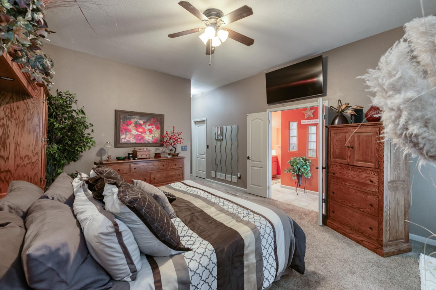 7360 Edgewater Street Chowchilla, CA 93610 - Photo 34 of 44 a bed room with a bed and a television