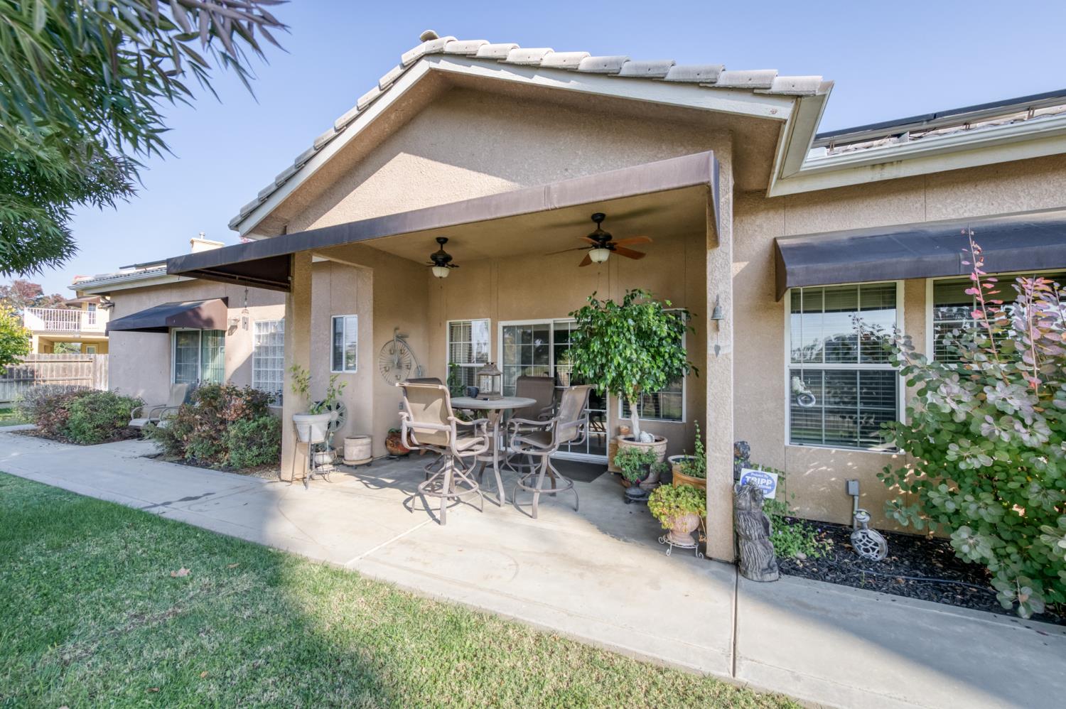 7360 Edgewater Street Chowchilla, CA 93610 - Photo 43 of 44 a view of outdoor space yard and porch