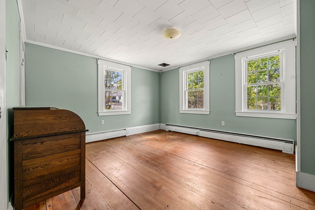 600 Main Street Ashby, MA 01431 - Photo 16 of 40 a view of a room with wooden floor and window