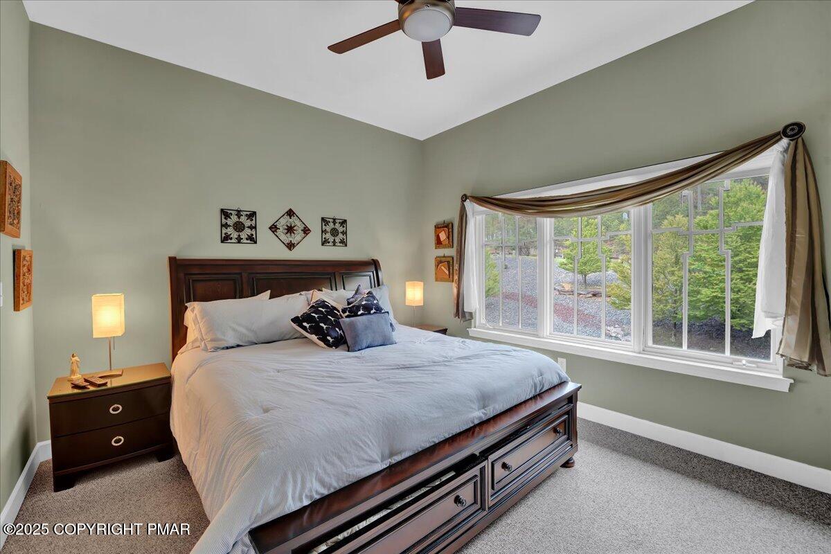 320 Hummingbird Way Lake, Unit 302J1 Lake Harmony, PA 18624 - Photo 15 of 29 a bedroom with a bed and a window