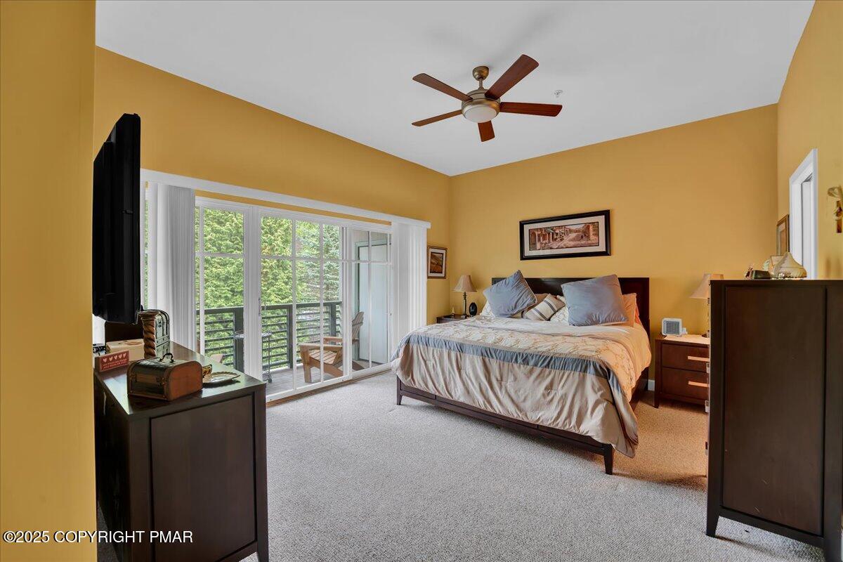 320 Hummingbird Way Lake, Unit 302J1 Lake Harmony, PA 18624 - Photo 17 of 29 a bedroom with a bed and a large window