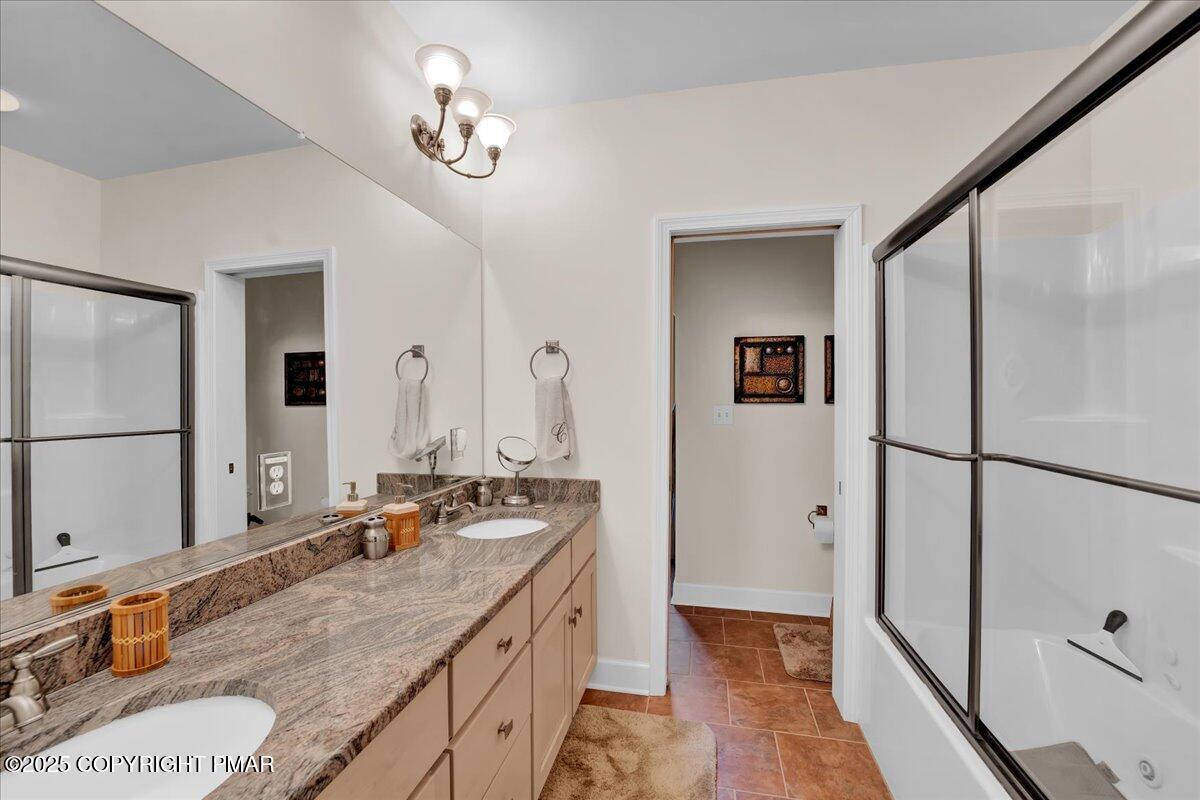 320 Hummingbird Way Lake, Unit 302J1 Lake Harmony, PA 18624 - Photo 19 of 29 a bathroom with double vanity and a mirror