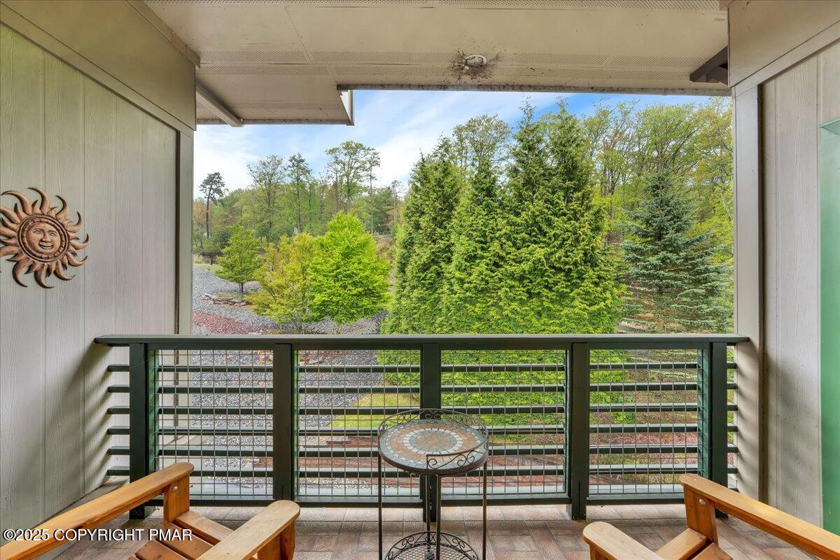 320 Hummingbird Way Lake, Unit 302J1 Lake Harmony, PA 18624 - Photo 22 of 29 a view of a chairs and table in a balcony