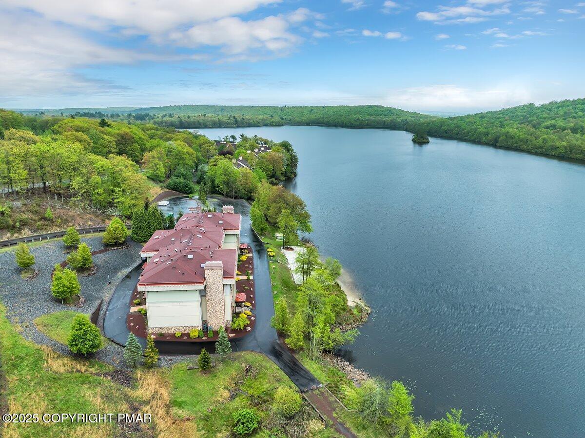 320 Hummingbird Way Lake, Unit 302J1 Lake Harmony, PA 18624 - Photo 25 of 29 an aerial view of a house with a garden and lake view